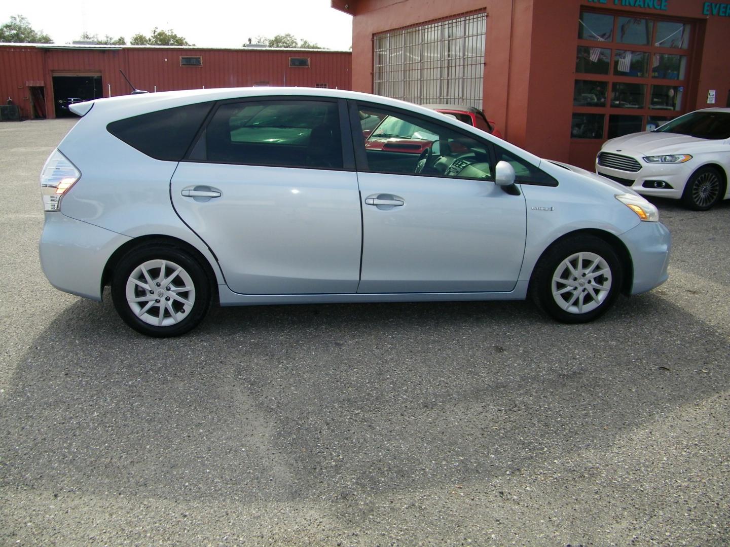 2013 Silver /Beige Toyota Prius V Three (JTDZN3EU5D3) with an 1.8L L4 DOHC 16V HYBRID engine, Continuously Variable Transmission transmission, located at 4000 Bee Ridge Road, Sarasota, FL, 34233, (941) 926-0300, 27.298664, -82.489151 - Photo#9